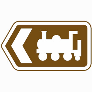 Brown road sign with train